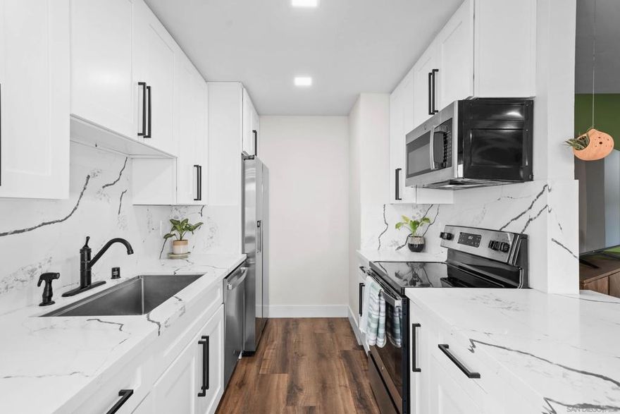 Seller willing to offer a interest rate buy-down w/ a considerable offer.  VA APPROVED!  Welcome to this beautifully updated bottom-floor condo in the heart of Oak Park.  Enjoy one of the only units in the complex with a private fenced in backyard, perfect for pets, gardening, or weekend barbecues, a rare find in this price range! Thoughtfully renovated interior featuring contemporary finishes, luxury vinyl plank flooring, fresh paint, & an updated kitchen with quartz countertops, shaker cabinetry, and stainless steel appliances. The open-concept layout flows seamlessly into the dining & living area, ideal for both relaxing & entertaining.  Washer/dryer hookups & energy efficient split AC/Heat in unit, plus extra storage.  Located in a gated community with assigned parking, guest parking onsite laundry, 2 pools & 2 jacuzzi's. Conveniently close to Chollas Lake Park, College Grove Shopping Center, SDSU, & major freeways.