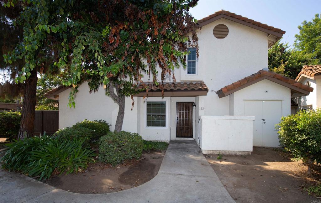 Wonderful 3 bedroom, 2 bathroom, gated Felicita Villas Condo, with 1 bedroom and 1 bathroom downstairs. Home is freshly painted, newer luxury vinyl, and tile flooring downstairs and new carpet upstairs. Kitchen features stainless appliances including dishwasher, refrigerator, and new range/oven and microwave, canned lighting. Living room has cozy fireplace, ceiling fan and looks out to the private backyard that is fully fenced, and has a brick patio. Interior laundry closet with washer/dryer. HOA includes water, trash, sewer, roof and common area maintenance, 1 pool and 3 spas.