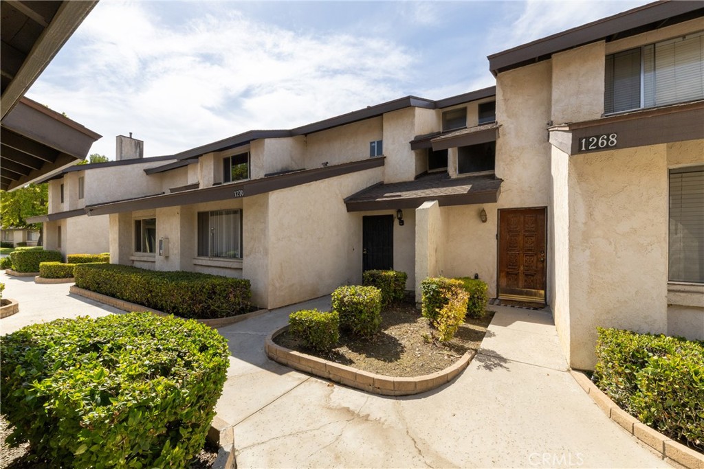 This beautiful two bedrooms, two full bath townhouse is located in desirable area of Colton near Loma Linda and VA medical facilities. 1,472 square feet of spacious floor plan is well organized with one bed room down stairs and the massive master bedroom upstairs. The kitchen and the living room area on the main level are well appointed for comfortable living. Laminated wood flooring throughout the unit making it easy to clean and gives the modern appeal. The entire interior is freshly painted. Recessed lighting in the hallway and the kitchen for brightness and modern look. Upstairs laundry room is for full-size washer and dryer. Unlike many other community living, this unit offers a detached one-car garage and plenty parking spaces are available for guests . This highly desirable location is close to schools, hospitals, shopping, dining, and easy access to major freeways for commuters. Well-managed HOA offers a pool and spa to cool you off and it has secure mailroom to protect your mail. It is available now. Come and let your eyes witness how beautiful and functional this unit is for you and your family.