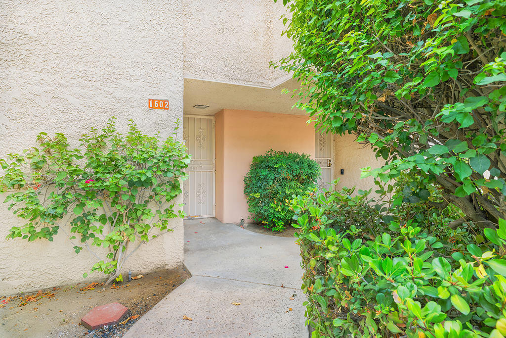 Recently renovated from top to bottom, this first floor home features all-new drywall, fresh paint, new cabinetry and sleek countertops, recessed lighting, and ceiling fans throughout. The fully tiled interior includes a modern kitchen with stainless steel appliances and soft close drawers, two bedrooms each with their own private bathroom, and three private patios to enjoy the sunshine.You own the land at Versailles. Community amenities include four swimming pools, two tennis courts, and covered parking. HOA dues cover water and trash service. Conveniently located close to shopping, dining, casinos, and all the fun that Palm Springs has to offer.