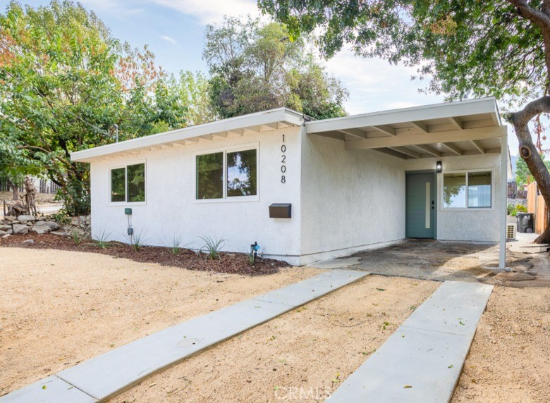 Welcome to 10208 Marcus Avenue — a beautifully updated single-story home with a newly plastered pool and fresh tile work, located in a peaceful Tujunga neighborhood.
This residence is listed as 2 bedrooms and 2 bathrooms per public record, plus a bonus room currently used as a third bedroom, providing flexible living options.
Inside, you’ll find modern updates throughout, including a new roof system, brand-new windows, updated flooring, and a custom kitchen with new cabinetry and quartz countertops. Both bathrooms have been thoughtfully renovated — the hall bath features new tile, vanity, and lighting, while the primary bath offers updated flooring and shower surrounds.
Fresh interior and exterior paint make this home truly move-in ready, blending comfort with style. Step into the backyard and enjoy a private pool retreat, perfect for entertaining or relaxing in the California sunshine. While the property does not include a garage, it offers ample parking with a driveway and covered carport.
Ideally located near local parks, hiking trails, and schools, this Tujunga gem is a must-see opportunity for today’s buyers.