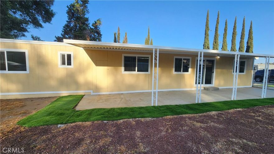 What a great buy for a home that has just been remodeled. This manufactured home is on a permanent foundation. Improvement include New Cabinets, New Flooring, New Windows, New Doors, New Stove, Newer Plumbing and more. Features 2 Bedrooms and 1 Bathroom. The laundry area is inside in the hallway. Stay warm in the winter with the central heater unit which is also AC ready. Carport for 2 to 3 cars plus additional parking in the front. There is also a concrete slab and patio on the opposite side. Additional storage space in the shed located in the back yard. Completely fenced in with chain link fence. You won't find another home in this condition at this price. Come and make it yours today!