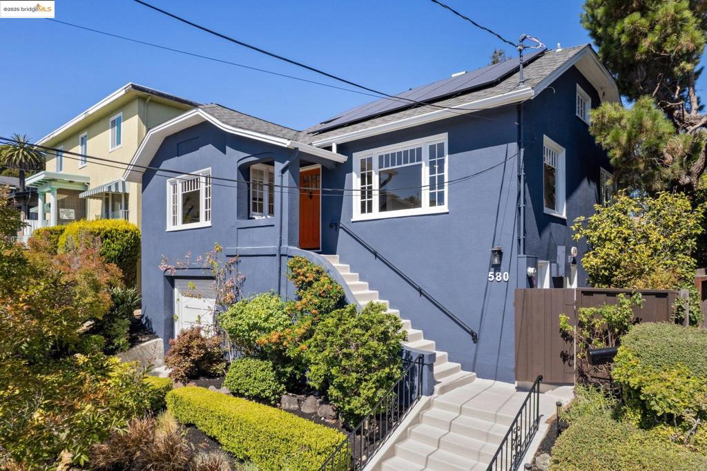 580 Kenmore Ave is an urban-chic Craftsman in Oakland’s coveted Upper Lakeshore neighborhood. Blending timeless character with modern updates, this home offers a gourmet kitchen with stainless steel appliances, butcher block counters, and custom finishes. The spacious living room, formal dining with original built-ins, and a light-filled family room with level-out access to the garden create seamless indoor-outdoor living. The serene primary suite boasts a private soaking tub, while two additional bedrooms and a lower-level bonus room with separate entrance provide flexibility. Practical upgrades include an owned solar system, EV charger, battery backup, and a detached climate-controlled office/studio. Set on a generous lot and just minutes from Lakeshore and Grand Avenue’s shops, dining, Grand Lake Theater, and the weekly Farmers Market, 580 Kenmore offers the best of East Bay living—stylish, sustainable, and ideally located.