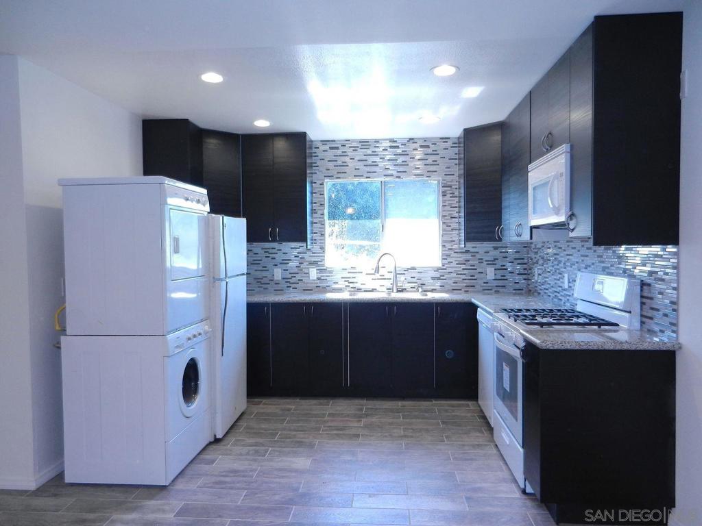Beautiful 2BR/1BA private upstairs unit. It has its own parking space and entrance to the unit. Unit has been recently remodeled! Most all appliances are brand new. Washer and dryer inside unit. Living room and kitchen are open concept plan. Own private fenced yard. This unit is In a great location, close to freeways, restaurants! 2 assigned parking spots. Pets okay. Trash included. Tenant responsible for all other utilities. Separate Yard for this unit.