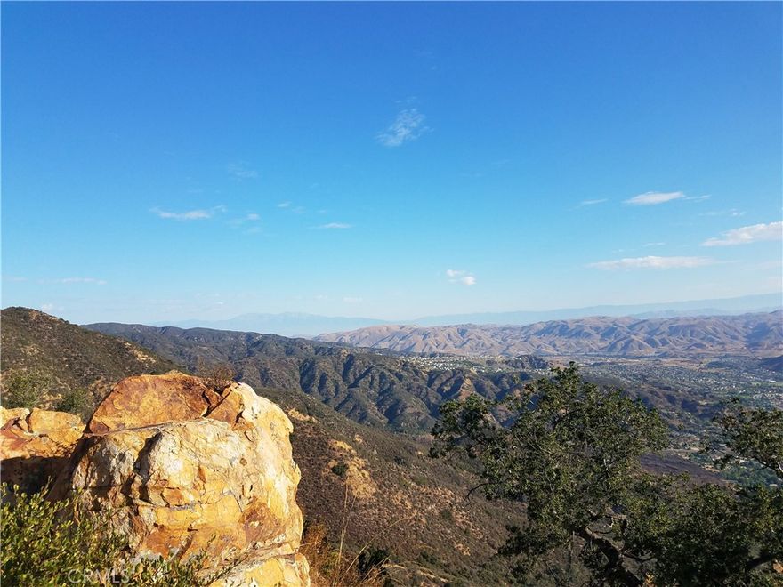 Expansive views of over 5000 sq miles of views! Mountains, Lake, and Hills. This parcel sits on the North Main Divide overlooking Lake Elsinore.