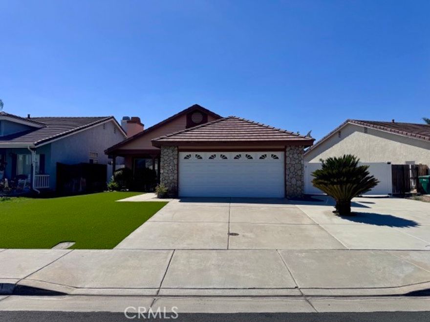 Welcome to this beautifully maintained 3 bedroom, 2 bathroom single story home, now available for lease in a prime Menifee location! Boasting great curb appeal, this home features low-maintenance artificial turf, an oversized driveway, a two car garage, and a welcoming front porch. Inside, you'll find brand new light toned plank flooring and a fresh, neutral paint scheme throughout. The spacious family room greets you upon entry and features a cozy fireplace, perfect for relaxing evenings. The adjacent kitchen offers classic oak cabinets, tile countertops, white appliances, and opens to a bright dining area with a built-in cabinet pantry for extra storage. All bedrooms and bathrooms are located down the hallway, including the generously sized primary suite, which is filled with natural light and features a walk-in closet, sliding glass door to the backyard, and an ensuite bathroom with dual sinks and a shower/tub combo. Venture outside to a large, open backyard designed for enjoyment and low maintenance. You'll love the expansive covered patio, wide side yard, rock landscaping, and a versatile storage shed, ideal for hobbies, storage, or a workshop. Conveniently located just minutes from shopping, dining, schools, and the 215 freeway. Plus, you're directly across the street from Lyle Marsh Park and Chester Morrison Elementary School! Don’t miss out, schedule your showing today!