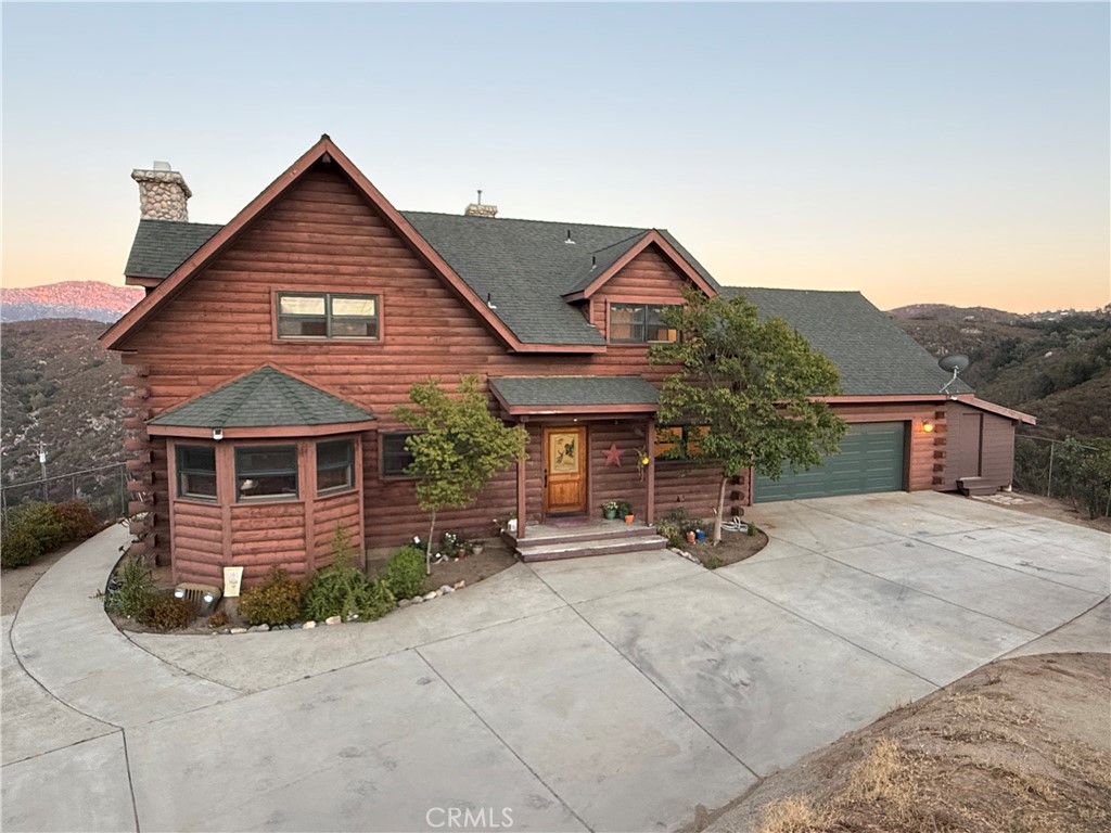 Cozy and comfortable...Don't wait for a weekend getaway. Enjoy the serenity & fresh air of a rustic log cabin retreat every day w/ views as far as the eye can see & enough space to spread out in nature. Constructed in 2005, this well-appointed log home offers 2000+ sq ft w/ a Master Suite on each level. The Living Room with its soaring 30 ft ceilings and the versatile loft or bedroom area are some focal points of this home. The cozy living room fireplace is perfect for those cold winter evenings. See supp Neighborhoods: Valley Center Architectural Style: A-Frame/Dome/Log View: A-Frame/Dome/Log Equipment: Fire Sprinklers, Garage Door Opener, Range/Oven.