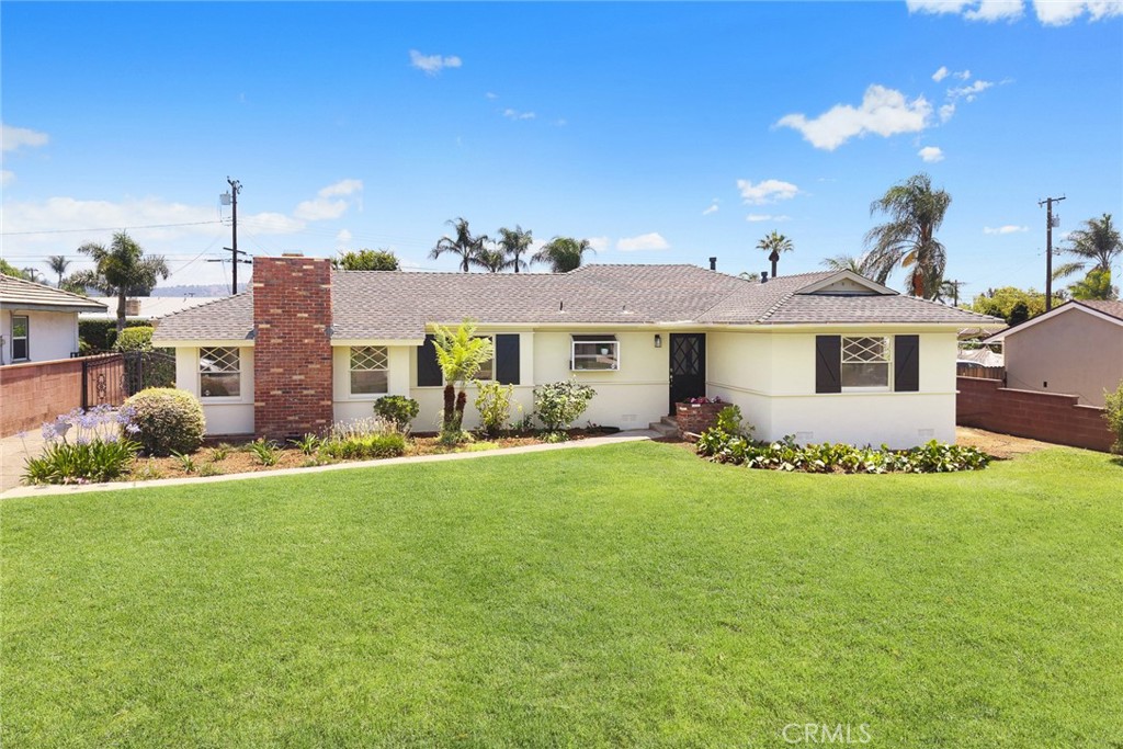 Welcome to your new lifestyle in this inviting mid-century ranch home, tucked away on a peaceful cul-de-sac in Covina’s sought-after Charter Oak neighborhood.
From the moment you arrive, you'll feel the pride of ownership that shines through this well-loved home. Step inside to discover warm hardwood floors, sunlit living spaces, and a layout designed for both comfort and connection. The cozy kitchen, complete with a cheerful breakfast nook, is perfect for morning coffee or lazy weekend brunches.
Just beyond, a spacious den with a brick fireplace and its own private entrance offers a versatile retreat—ideal for movie nights, a home office, or hosting guests.
The primary suite is your personal sanctuary, featuring a generous walk-in closet and a spa-like bathroom with a walk-in shower and soaking tub. At the front of the home, two additional bedrooms with original hardwood floors share a bright hallway bath—ideal for family or visiting friends.
French doors off the living room open to a sunny deck, where you can lounge in the afternoon sun or dine under the stars. The backyard is a hidden gem, with mature fruit trees, a tucked-away garden space behind the garage, and room to play, plant, or simply unwind.
Recent upgrades include fresh interior and exterior paint, a new water heater (2025), and a partial roof replacement (approximately 80%) for peace of mind.
The oversized 2.5-car detached garage is a rare find—ready for your workshop dreams or future ADU potential. A gated driveway offers plenty of room for an RV, boat, or extra vehicles—tucked securely out of sight.
Whether you're hosting gatherings, growing your garden, or just enjoying the quiet charm of the neighborhood, this home offers a perfect blend of comfort, space, and opportunity.
Don’t miss your chance to make this timeless home your own in one of Covina’s most established and welcoming communities.