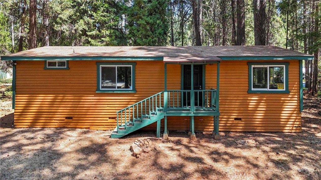 Discover a beautifully modernized 2-bedroom, 2-bath home perfectly situated on a generous 0.23-acre lot surrounded by fragrant pine trees. Built in 1989 and thoughtfully updated, this 1,092-square-foot residence effortlessly combines comfort, style, and a serene setting you’ll love coming home to.
Step inside to a bright, open floor plan where large windows flood the living room, dining area, and primary bedroom with natural light. Freshly painted walls and plush new carpeting create a warm, inviting backdrop that feels both modern and cozy. The spacious layout offers plenty of room for entertaining or relaxing in comfort. The heart of the home is the recently renovated kitchen, showcasing gorgeous pine cabinets, new countertops, and a host of modern appliances—including a propane stove/oven, range hood, dishwasher, and refrigerator. A charming nook for a breakfast table adds a casual dining spot perfect for morning coffee. Retreat to the primary suite, a peaceful haven featuring a ceiling fan, a walk-in shower, ample linen storage, and a full wall of mirrored sliding doors covering the walk-in closet, adding both functionality and a sense of spaciousness. Additional thoughtful touches include an interior laundry room, covered front and back porches, carport, and a large storage shed, all set on an expansive lot for outdoor enjoyment. Friendly neighbors contribute to a warm and welcoming community atmosphere. Conveniently located with easy access to B-Line (Butte Transit), this home offers effortless connectivity for commuters and students, while its elevated position ensures a cooler, more comfortable climate than the valley. Whether you’re a first-time buyer, downsizing, or seeking a smart investment, this move-in ready home presents a rare chance to enjoy a well-maintained, charming property in a peaceful setting. Don’t miss out—schedule your private tour today and see all it has to offer.