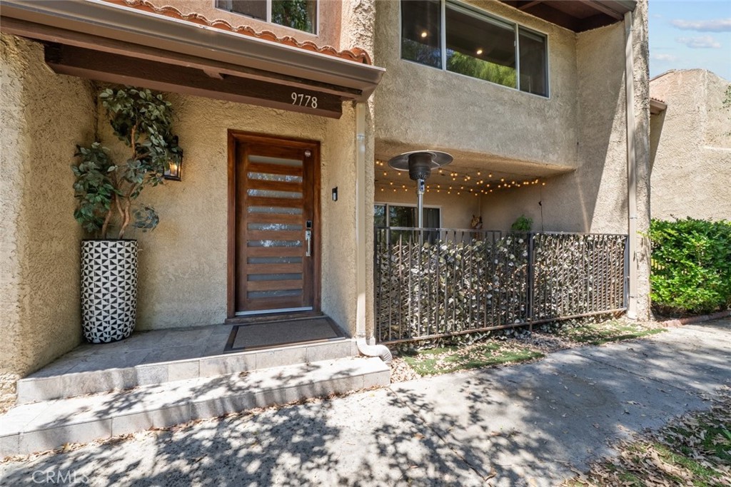 Experience the best of Burbank living in this beautifully upgraded 3-bedroom, 3-bathroom townhome, offering 1,664 square feet of sophisticated style and comfort. This residence blends open concept design with elegant finishes, featuring wide-plank flooring, crown molding, recessed lighting, and a custom-built bar, perfect for entertaining. The gourmet kitchen is equipped with sleek cabinetry, stone countertops, stainless steel appliances, and a modern farmhouse sink. Enjoy the spacious dining area, ideal for gatherings, or unwind in the inviting living space flooded with natural light. The spacious primary suite offers, a spa style bathroom, and a large walk-in closet with built-in custom drawers. Escape to your private outdoor space, perfect for a quiet cup of coffee or unwinding in peace. The 2-car garage features laundry hookups and a bonus room, ideal for extra storage or a home office. Residents also enjoy access to resort-style amenities including tennis courts/pickleball, basketball and volleyball courts, several pools, clubhouse and 24 hour security. Located in a vibrant Burbank neighborhood with proximity to top schools, shopping, dining, and studios, this is a rare opportunity to lease a turnkey home in a prime location. Welcome Home!