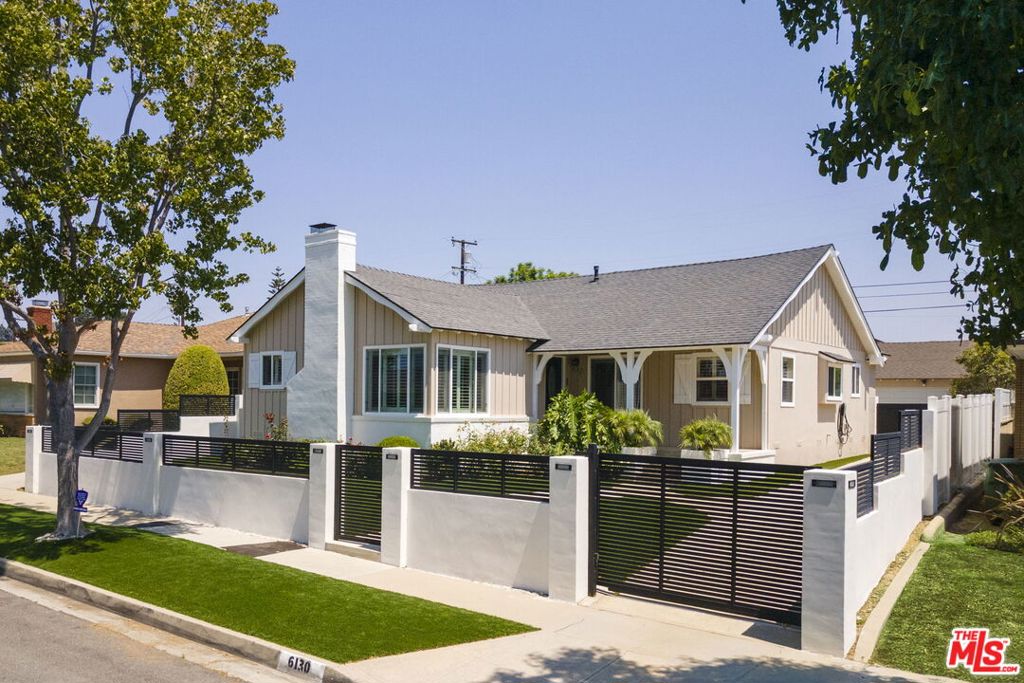 Welcome to this beautifully remodeled three-bedroom home, nestled on a spacious lot in the serene neighborhood of Ladera Heights. As you step into the formal foyer, you are greeted by a sunbathed and expansive living room adorned with recessed lighting, a decorative fireplace, crown molding, and newer windows with plantation shutters. The formal dining room is perfect for entertaining, offering an elegant setting complemented by wainscoting and a warm, inviting ambiance that enhances every gathering. The remodeled eat-in kitchen is a chef's delight, boasting stone floors, granite countertops, custom cabinetry with a built-in wine and glassware rack, and modern stainless steel appliances, catering to both casual meals and gourmet cooking. This home features three spacious bedrooms, with two primary suite options. One of these suites provides direct access to the backyard, creating a private retreat. The family room is ideal for gatherings and relaxation, with ample space for hosting friends and family. It serves as a central hub where comfort and style meet, perfect for movie nights or casual get-togethers. The low maintenance turfed backyard is a wonderful outdoor oasis featuring lush green turf that offers ample space, and there's even room for a pool, making it perfect for outdoor activities and leisure. The detached two-car garage offers versatility, providing the future option to convert it into an ADU or guest house, ideal for accommodating guests or generating rental income. Additional features include central air and heat, newly turfed front and backyards, an electric vehicle charging station, and a newly fenced-in front yard with an electric motorized gate. All of this is situated in a fantastic location with easy access to freeways and public transportation. You're just minutes away from SoFi Stadium, Intuit Dome, Culver City, Westfield Culver City Mall, and local hotspots like Somerville, Jon & Vinny's, and Hilltop Coffee and Kitchen. Seize the opportunity to own this remarkable home where modern amenities and an unbeatable location come together to offer a truly exceptional living experience.