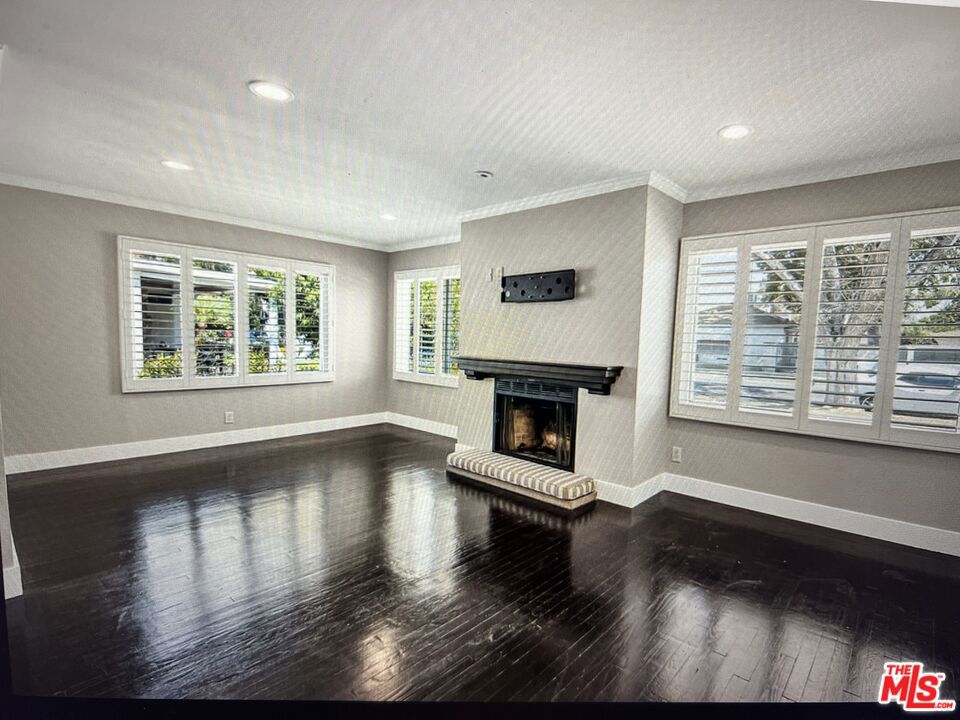 LOOKING FOR A LEASE??? Look no more! This adorable gem on a tucked away street in Reseda is perfect! Three good sized bedrooms, and a darling updated bath --plus beautiful dark stained wood floors---and the BEST part: the plantation shutters throughout! They keep the house so cool, you may not have to turn on the air conditioning in summer! The open floorplan of the living room and dining area offer a decorative fireplace. There's recessed lighting that will showcase any artwork you want to display. The kitchen includes new appliances, and a cozy breakfast nook area. The laundry area is adjacent with new washer dryer included too! Step outside to the grassy backyard--for relaxing or maybe even a game of croquet....? BIG bonus: Solar Panels!!! to help you go GREEN! The two car garage is accessed from the alley plus a large additional parking pad--in case you need a place for your RV! Close to Encino, the Sepulveda Basin Off-Leash Dog Park and the expansive Lake Balboa park. AVAILABLE FOR SEPTEMBER!!!!