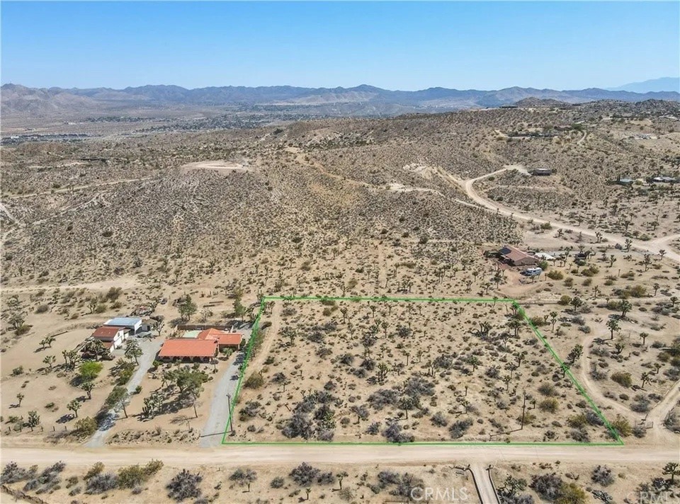 Incredible opportunity to own a prime parcel in the heart of Yucca Valley! Located on Sierra Vista Drive, this spacious lot offers the perfect setting to build your dream home, vacation getaway, or investment property. Surrounded by natural beauty and just minutes from downtown Yucca Valley, this property combines privacy with convenience. Utilities are nearby, and the land offers gentle topography with stunning desert and mountain views. Close proximity to Joshua Tree National Park, Pioneertown, shopping, dining, and local hiking trails. Zoned for residential use in a peaceful and well-established neighborhood. Don’t miss your chance to create something special in one of the High Desert’s most desirable communities