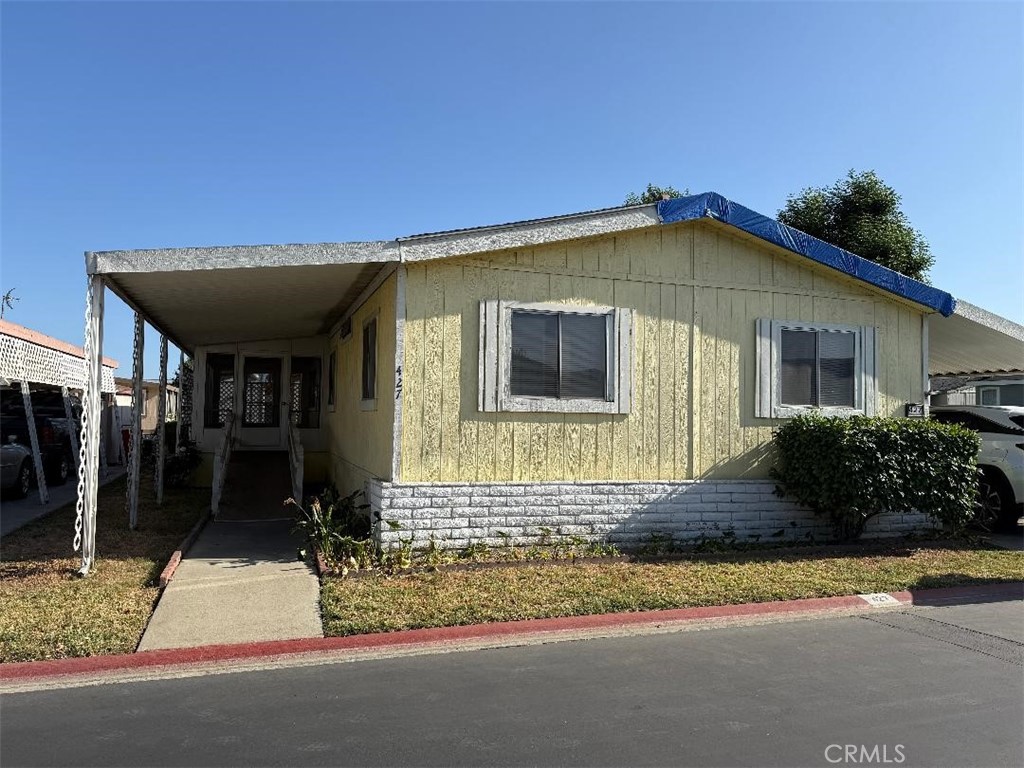 LOCATION, LOCATION, LOCATIION!!!!! This manufactured home sits in the beautiful 55+ Rancho Ontario Park. Sits next to VISITOR PARKING! Also, next to a green belt. Kitchen has new appliances, except the dishwasher. 3 bedrooms, 2 baths, 1440 sq ft Master suites are on one side, 2 bedrooms on the other side. GREAT FLOOR PLAN! Fireplace, open, and spacious! This park has two dog parks, bocci ball, pickle courts. The carport can fit 4 cars.