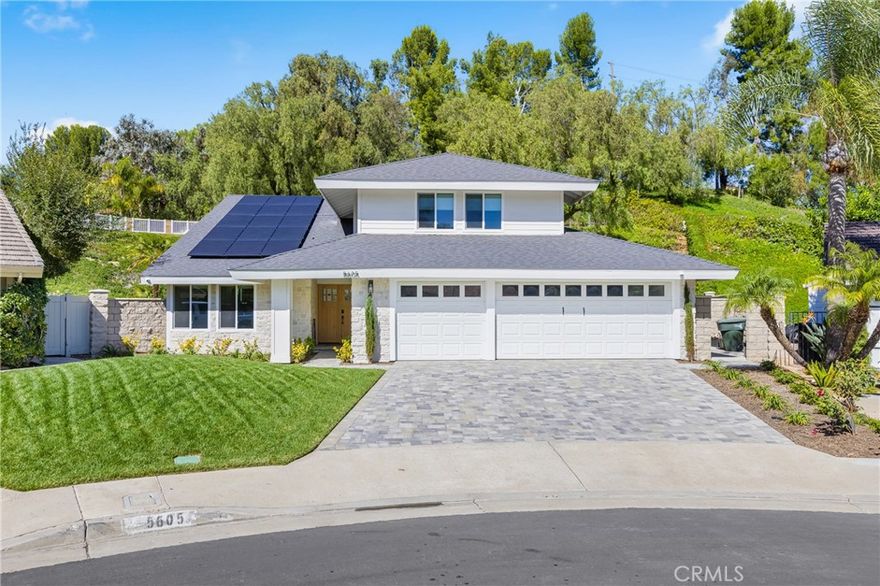 Welcome to this stunning, turnkey four-bedroom home on an expansive pie-shaped lot at the end of a quiet cul-de-sac in the heart of Anaheim Hills—close to top-rated schools, shopping, dining, and convenient freeway access. Perfectly remodeled inside and out, this home blends modern sophistication with timeless comfort in a prime location.
Step through custom wood double entry doors into a bright, open floor plan with soaring vaulted ceilings and an abundance of natural light. The spacious living and family rooms feature a beautiful stone fireplace and seamless flow into the remodeled kitchen—an entertainer’s dream with granite slab countertops, full-height custom stone backsplash, rich wood cabinetry, stainless steel appliances, a large breakfast counter, and custom range hood. Recessed lighting and new contemporary fixtures enhance the inviting atmosphere throughout.
Extensive hardwood flooring runs across both levels, accented by new baseboards, door casings, and hardware. The home includes energy-efficient dual-pane windows, custom window coverings, and ceiling fans for year-round comfort. A conveniently located indoor laundry room connects directly to the finished three-car garage with sectional roll-up doors.
Upstairs, the reimagined primary suite offers a luxurious spa-inspired retreat featuring a soaking tub, walk-in shower with multiple shower heads—including a rain shower—frameless glass enclosure, and custom stone dual vanity. A large walk-in closet with built-in cabinetry completes this elegant space.
The exterior is equally impressive, boasting a limestone-clad façade, extensive paver stone driveway, walkways and rear patio, well manicured landscaping, and a large private backyard. The expansive covered patio and adjoining lawn create the perfect setting for outdoor entertaining or peaceful relaxation. Additional features include block and garden walls, paid solar system, and low taxes with a low HOA.
From the impeccable craftsmanship to the thoughtful upgrades and flexible layout, this Anaheim Hills gem truly has it all—comfort, style, and exceptional value in one of the area’s most sought-after neighborhoods.