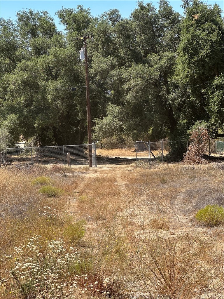 Beautiful rolling 18.16 acres for custom home with vineyard & plenty of room for horses. Parcel is fully fenced, has power & transformer on property, also has phone pedestal on parcel. Breathtaking views in all directions. Neighbors have large vineyards & fruit tree orchards. Perfect for your dream home in the country in a very peaceful, desirable area, don't let this one get away. Has a cargo container & tractor that are included in purchase price.