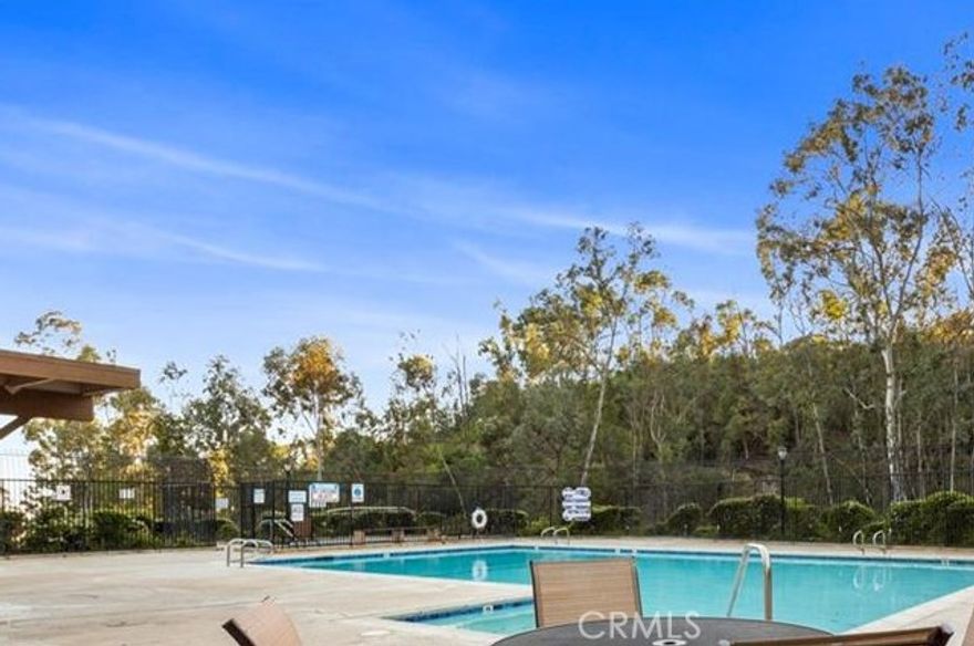 One of the best location with peaceful view. Extremely bright, airy and quiet in Coyote Hills "Green” town home community. Tri level open floor plan with 3 bedrooms and 2.5 bathrooms (Approx. 1,561 SQ.FT.). Double door entry Entry. Living room, formal dining room, half bath, kitchen and eating area in main floor. Spacious living room has travertine-accented fireplace with dramatic cathedral ceiling. Sliding glass doors lead to oversize deck area off of the formal dining room with city lights view. Huge master suit with double door entry and master bath in upper level. Downstairs bonus room (family room) or could be 3rd bedroom, with sliding glass doors to fully fenced large patio. Direct access to 2 car attached garage with laundry area. Full driveway. A wonderful surrounding nature and very well kept by the HOA with association pool &spa. Bike and hiking Trails, Ralph Clark Regional park, Golf courses, Shopping center nearby. Award winning schools.