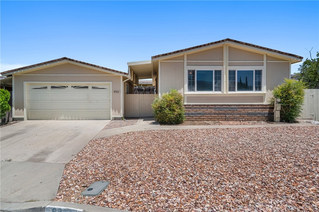 Nicely remodeled, 3 Bedroom Home. You own the Land. Not in a park. In a well maintained community tract tract with pride of ownership. New Kitchen, New Flooring, Updated Dual Pane Windows, New Paint inside and out, New Cabinets, New Quartz Counter Tops, New Stainless Steel Appliances. 3 Bedroom / 2 Bathroom Home with a 2 Car Garage in a nice Neighborhood with a Community Pool, Tennis Courts, Basketball Court and 24 Hr Security. Very Low HOA. Close to the Crossings, Tom Farms and Sycamore Creek Shops. This affordable newly remodeled 3 Bedroom Home with 2 Car garage with a nice private back yard in Corona will not last. Hurry and make this Home yours before it's gone!
