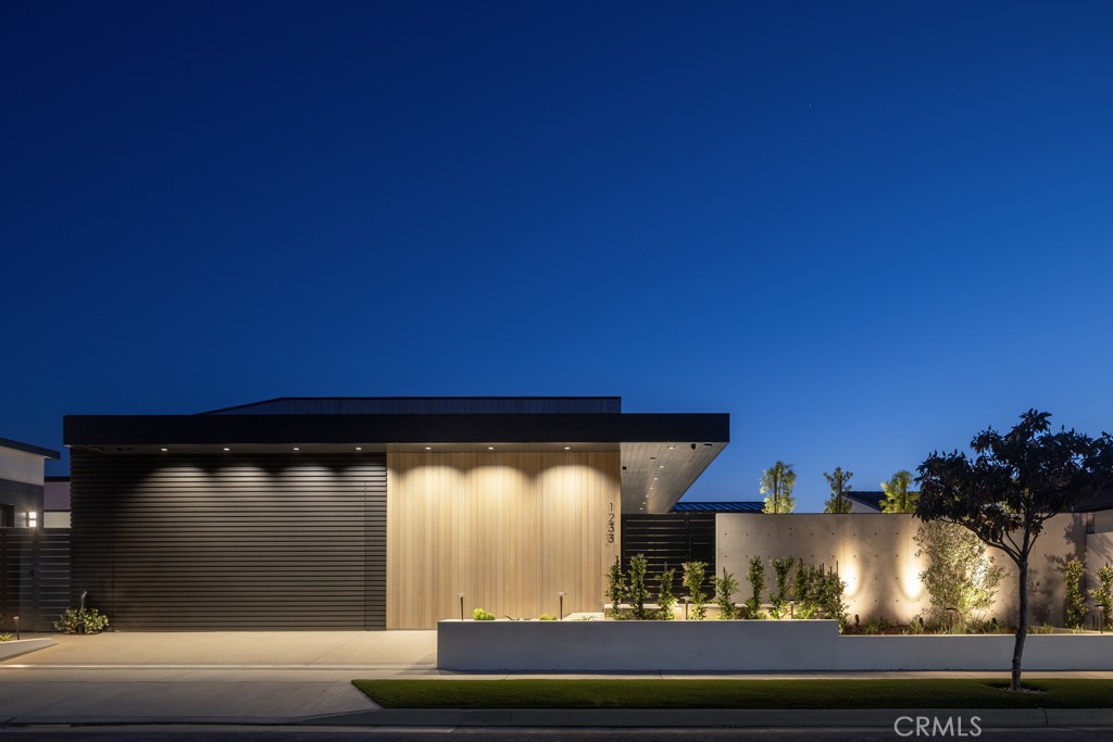 Located in the prestigious community of Harbor View South, 1233 Outrigger Drive is a showcase of modern coastal design. Newly constructed and thoughtfully crafted for discerning tastes, this single-level residence offers an extraordinary lifestyle defined by panoramic vistas, refined interiors, and seamless indoor-outdoor living. Set against the backdrop of the Pacific Ocean, Newport Harbor, Catalina Island, and twinkling city lights, the home captures the essence of Southern California luxury. As you enter through the courtyard, you are immediately welcomed by a gracious pool, spa and alfresco dining space. The stacking glass doors open to light-filled spaces wrapped in a calming neutral palette. Vaulted ceilings, custom finishes, and sophisticated textures define the interiors, while wide-plank oak flooring and understated stonework lend warmth and elegance. Enjoy an open-concept living and dining area anchored by a designer kitchen equipped with professional-grade appliances, a large waterfall island, and custom cabinetry,—designed to meet the needs of both everyday living and large-scale entertaining. Floor to ceiling glass doors open to a backdrop of eye-catching views, where a patio and fire pit invite relaxation amid panoramic coastal scenery. The primary suite is a private retreat featuring breathtaking ocean views, a spa-inspired bath with soaking tub and dual vanities, and a custom walk-in closet. Secondary bedrooms offer en-suite bathrooms and thoughtfully designed layouts for comfort and privacy. A dedicated office provides flexible living space. Additional highlights include a two-car garage, smart home technology, and meticulous landscaping that complements the home’s clean architectural lines. Ideally located moments from the beaches of Corona del Mar, Fashion Island, and world-class dining and yachting, this is a rare opportunity to own a single-level, view-forward home in one of Orange County’s most sought-after neighborhoods.
