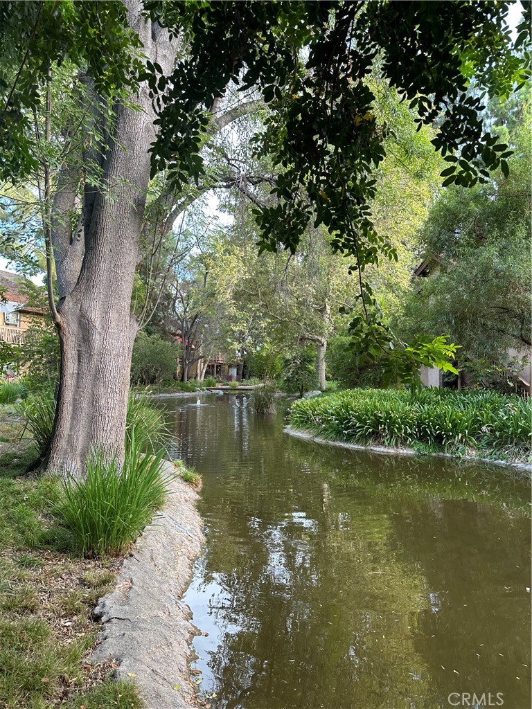 Canoga Lakes popular 2-bedroom downstairs unit in an amazing location with beautiful stream and lush landscaping views. Enjoy al-fresco dining or your morning coffee on the expanded back patio and take in the tranquil atmosphere of the ducks, humming birds and Koi fish. Upgrades include laminate flooring, fresh paint and there is a new AC unit and also a new electrical panel. The laundry has its own convenient area right inside the unit and the washer and dryer are included. There are 2 assigned parking spots for the unit (which are spots 476 and 485) and water, trash, earthquake insurance are covered by the HOA. HOA amenities include 2 sparking pools, 2 Jacuzzis, Fitness room, lighted tennis courts and 18 acres of walking paths, towering trees, green belts and sitting benches to enjoy the fascinating views. Canoga Lakes is situated in a vibrant neighborhood close to transportation, hospitals, fine restaurants and entertainment. You are in close proximity to "the Village", Topanga Plaza Shopping Center, Fallbrook Mall, Malibu Wines and so much more. Relax and enjoy yourself, you are going to love living in Canoga Lakes. This probate transaction is subject to the statutory provisions of the IAEA, including Notice of Proposed Action, potential court confirmation, and overbid rights.