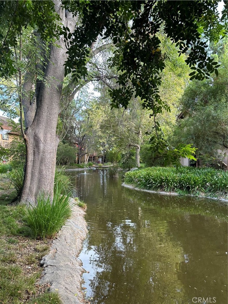Canoga Lakes popular 2-bedroom downstairs unit in an amazing location with beautiful stream and lush landscaping views. Enjoy al-fresco dining or your morning coffee on the expanded back patio and take in the tranquil atmosphere of the ducks, hummingbirds and Koi fish. Upgrades include laminate flooring, fresh paint and there is a new AC unit and also a new electrical panel. The laundry has its own convenient area right inside the unit and the washer and dryer are included. There are 2 assigned parking spots for the unit (which are spots 476 and 485) and water, trash, earthquake insurance are covered by the HOA. HOA amenities include 2 sparking pools, 2 Jacuzzis, Fitness room, lighted tennis courts and 18 acres of walking paths, towering trees, green belts and sitting benches to enjoy the fascinating views. Canoga Lakes is situated in a vibrant neighborhood close to transportation, hospitals, fine restaurants and entertainment. You are in close proximity to "the Village", Topanga Plaza Shopping Center, Fallbrook Mall, Malibu Wines and so much more. Relax and enjoy yourself, you are going to love living in Canoga Lakes. This probate transaction is subject to the statutory provisions of the IAEA, including Notice of Proposed Action, potential court confirmation, and overbid rights.