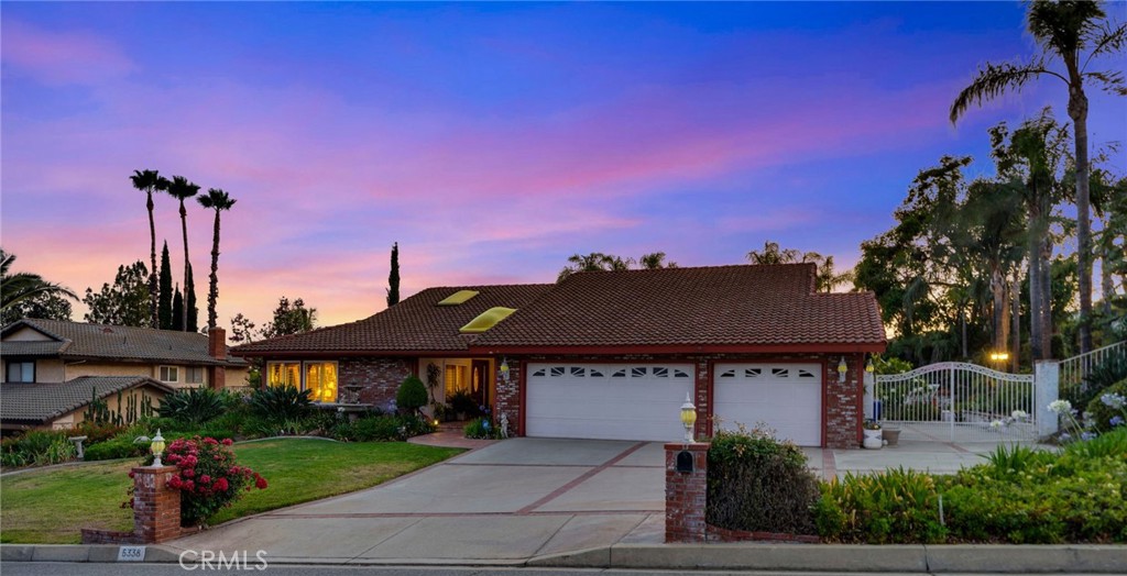 Tucked in the desirable Alta Loma Foothills, this impeccably maintained single-story pool home stands out as one of the few one-level residences in the area currently on the market. The charming brick façade, lighted pillars, & wide concrete driveway create an inviting first impression. A beautifully landscaped front yard and an entry courtyard welcomes you into the home.
Inside, you'll find an abundance of natural light courtesy of multiple skylights and soaring cathedral ceilings. The layout is both functional and elegant, featuring a separate formal living room and dining room right off the entry, adjacent to the kitchen for ease of entertaining. The updated kitchen boast granite countertops, a built-in refrigerator, double oven, 6 stove top, built-in microwave, ample cabinetry, and even a built-in wine rack. On the opposite side of the kitchen is an informal dining area that flows into a cozy family room complete with a brick fireplace, custom mantle, and built-in entertainment center. Two expansive sliding doors open to the stunning backyard, blurring the line between indoor and outdoor living. Throughout the home, windows are fitted with plantation shutters or tasteful window treatments, offering privacy, class and style.
The primary suite is generously sized, offering double closets, a large window, and a private en-suite bathroom that includes a soaking tub, private water closet, dual vanities with granite countertops, and an abundance of storage space. The updated hallway bathroom features a standalone shower and granite vanity.
The backyard is a true show stopper, an entertainer’s paradise. Framed by mature palms and lush landscaping, the space features a sparkling pool with a rock waterfall and a spa. The backyard offers extensive outdoor lighting. An oversized covered patio sets the stage for unforgettable gatherings. Elevated steps above the pool lead to an open space ideal for events, parties, or the potential addition of another dwelling. Pavers surround a tranquil water fountain and is the perfect place to unwind.
Additional amenities include a dedicated laundry room that doubles as a mudroom with backyard access, central HVAC, and an attached three-car garage with pulldown attic storage. RV or boat parking is securely tucked behind a wrought iron gate, completing this home’s impressive list of features. This is California living at its finest; single-story convenience, meticulous upkeep, and an outdoor space that’s second to none.