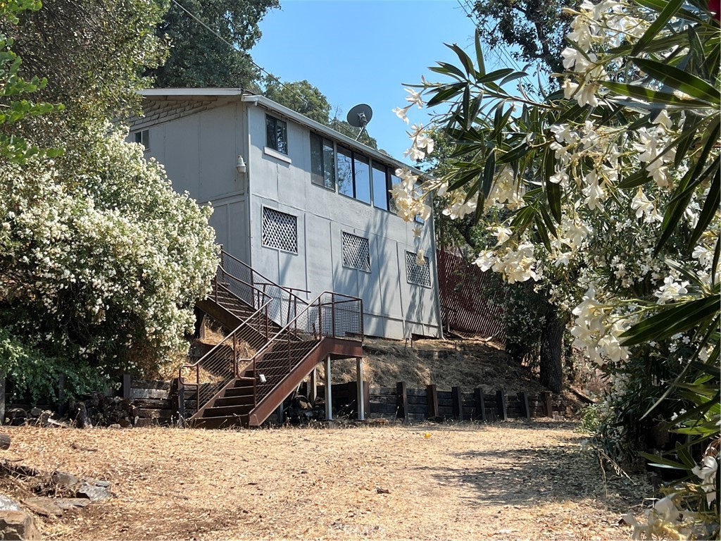 Lakefront Opportunity! dual-parcel property offering the best of both worlds—stunning panoramic views and direct lakefront access. This unique setup includes a cozy 1-bedroom, 1-bath vintage lakeview home perched above the highway, along with a separate waterfront parcel just across the road. Whether you’re dreaming of a peaceful weekend escape, a vacation rental, or a full-time residence with added value, this versatile property checks all the boxes. The charming 672 sq ft home sits on nearly half an acre and features beautiful wood flooring, tile countertops, and a sunny living space with unobstructed views of Clear Lake and the surrounding mountains. Step outside to enjoy a private patio perfect for morning coffee or evening sunsets.
Across the road, your lakefront parcel opens up a world of opportunity—imagine launching kayaks, fishing at sunrise, or building a dock (buyer to verify). The lake parcel offers a direct connection to the water, adding significant lifestyle value and recreational appeal. With easy access via a private utility easement, water pumped directly from the lake, and no HOA restrictions, the property invites creative vision. Use it as a serene lakeside retreat, develop it into a short-term rental with unmatched views, or explore its potential as a multi-use vacation compound.
Highlights:
• Dual parcel setup with lakefront access and lakeview home
• 1 bed, 1 bath vintage cottage (672 sq ft)
• Almost half an acre combined
• Stunning lake, mountain, and hill views
• Quiet and rural location with access to fishing, hiking, and water sports
• Great potential for Airbnb or vacation rental income