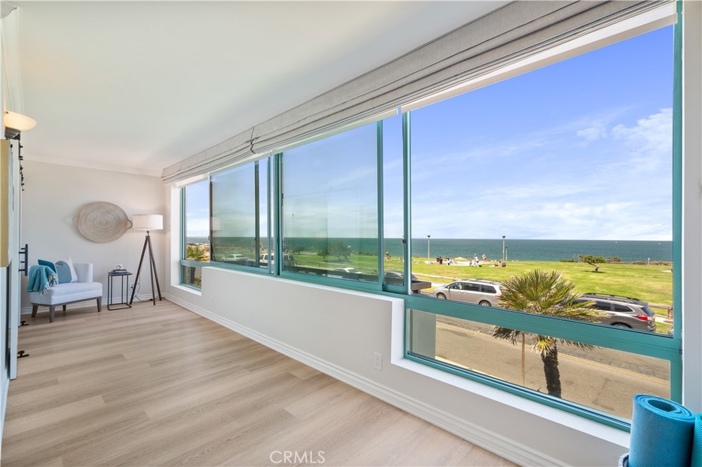 Experience coastal living at its finest in the heart of Redondo Beach’s highly sought-after Riviera Village! Situated in an iconic, architecturally distinctive building that’s a true work of art in the neighborhood, this beautifully updated 2-bedroom, 2-bath condo offers sweeping ocean views, refreshing sea breezes, and an unbeatable location just steps from the beach, dining, and boutique shopping.
Inside, you'll find an open and airy floor plan featuring wide plank luxury vinyl flooring and dramatic floor-to-ceiling, wall-to-wall windows that flood the space with natural light and frame the stunning ocean vistas. The remodeled kitchen boasts beautiful cabinetry, stainless steel appliances, granite countertops, and a striking custom Italian tile backsplash, all flowing effortlessly into the dining and living areas—perfect for entertaining or relaxing in style.
The spacious primary suite offers amazing ocean views, large closets with custom built-ins, and an updated en-suite bathroom. A second bedroom and full bath provide flexibility for guests, a home office, or both. Additional highlights include in-unit laundry, side-by-side parking in a secure garage, and a private storage area.
The well-maintained complex features a sparkling pool, controlled access, an elevator, and beautifully landscaped grounds. You’ll also love the fantastic community game room complete with a pool table, lounge area, and kitchen—perfect for hosting gatherings and entertaining friends.
Live just steps from the beach, the farmers market, and all the vibrant shops and restaurants of Riviera Village.
To Live, Live by the Sea!