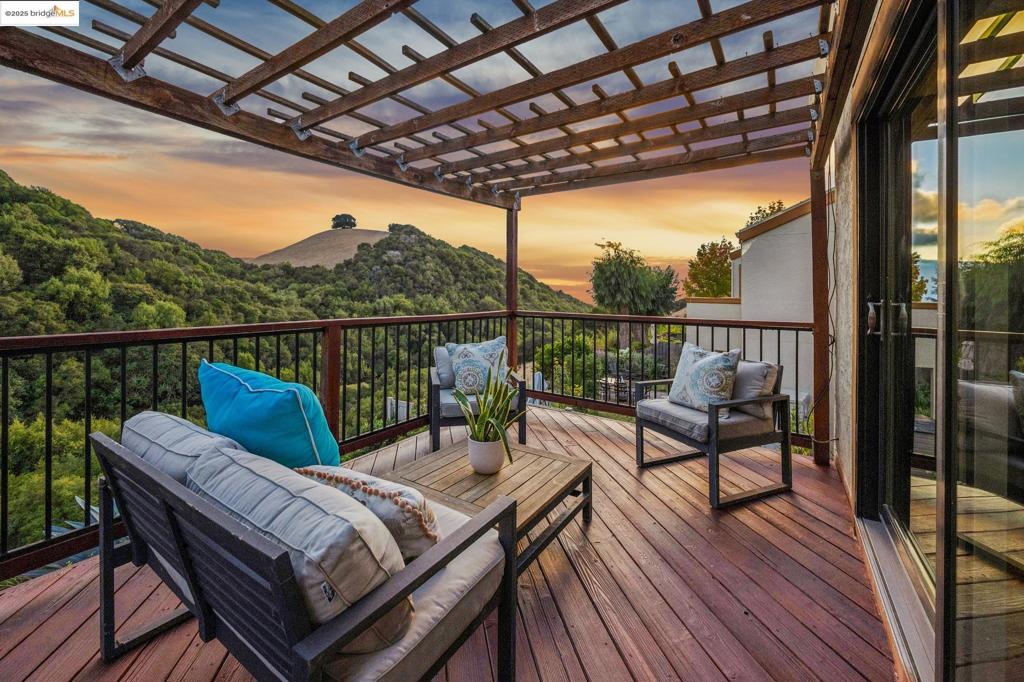 Prepare to fall in love with this 3 bedroom, plus office, 2.5 bath home on a cul-de-sac in the Hayward Highlands, with a gorgeous view and no rear neighbors. Enjoy the sun setting over the Bay from your primary suite deck on warm summer evenings, and the air conditioning inside on warm summer afternoons. Pride of ownership abounds with an updated kitchen, primary bath, solar panels, double-pane windows, and gleaming hardwood floors. Upstairs, you'll find a spacious primary suite with its own canyon views, plus two more bedrooms and a full bathroom. An additional room downstairs, currently set up as an office, offers flexibility for whatever your needs require.* Stonebrae Elementary is only one mile away.** The community pool is only a block away. The home backs up to 6000+ acres of open space and many miles of trails in Garin Regional Park for outdoor recreation or just communing with nature. *Buyer is advised to conduct their own investigation with appropriate professionals and verify with the city prior to proceeding with the purchase, and to rely solely on their own investigation. **Any interested parties should verify the school district and availability, as attendance and attending the closest school is not guaranteed.