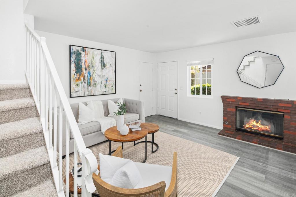 Welcome to this beautifully maintained 3-bedroom, 2.5-bath townhome with a private 2-car garage, located in the desirable Granite Hills area of El Cajon. Freshly painted with brand-new carpet, this home is truly move-in ready. The cozy living room features a fireplace and opens to the dining area and updated kitchen, complete with newer cabinets and granite countertops—perfect for entertaining or summer BBQs in the private backyard. The first floor includes a convenient half bath and an ideal layout for gathering with friends and family. Upstairs, you'll find a spacious primary master suite with a beautifully remodeled attached bathroom, along with two additional bedrooms and a full bath. With only one attached neighbor and situated at the back of the complex, this unit offers added privacy and a peaceful setting. The quiet, well-kept community includes a clubhouse and pool for you to enjoy. Whether you're a first-time buyer or looking to downsize, this is a fantastic opportunity to own a home in a beautiful location.