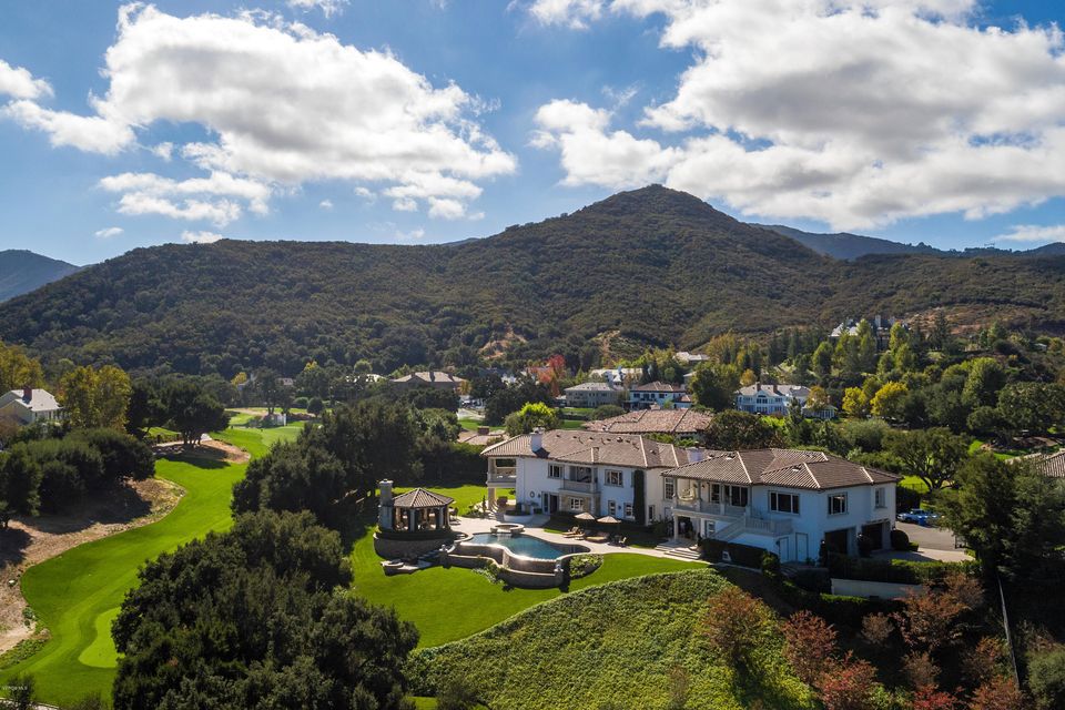 Set behind Sherwood Country Club gates, this pedigree estate is the ideal retreat in a prestigious setting. The 2-story foyer & spacious living areas create delightful interiors. The formal dining room embodies elegance & the remodeled kitchen features Callacatta marble counters & panoramic views, connected to the sun-filled living room. Designed to impress, the master suite includes a private balcony, sitting area & fireplace. The media suite includes a theater, game room, fitness center & overlooks the golf course fairway. Enjoy the best al fresco dining with an outdoor kitchen, fireplace & infinity pool. This property is an ideal celebrity estate spanning nearly 2 acres of private hillside with a verdant lawn with an oak grove creating a natural setting with privacy & marvelous views.