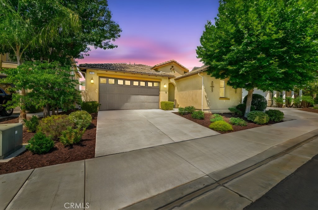 Located in the desirable gated community of Roripaugh Ranch, this beautifully designed single-story home offers 2,198 square feet of comfortable living with 3 bedrooms, 2.5 bathrooms, a versatile bonus room, and PAID SOLAR.
Step inside and you’ll find an open-concept floorplan perfect for both everyday living and entertaining. The spacious kitchen features a large center island with seating for four, granite countertops, white shaker cabinets, and stainless steel appliances. Flowing seamlessly into the family room and dining area, this central space creates a warm and inviting atmosphere. The bonus room adds flexibility—ideal as a formal dining room, office, or additional living space with its convenient access to the kitchen.
The private primary suite is thoughtfully separated from the secondary bedrooms and offers two closets, a spa-inspired bath with dual sinks and vanity, oversized soaking tub, and separate shower. The two secondary bedrooms are split by a full bathroom, with an additional powder bath for guests. Elegant touches throughout the home include crown molding and plantation shutters.
Step outside to your own private retreat—an inviting backyard with a covered patio and mature landscaping that creates both privacy and a serene place to enjoy Temecula’s year-round weather.
Living in Roripaugh Ranch means more than just a beautiful home—you’ll enjoy resort-style amenities including a large clubhouse, 24/7 fitness center, Olympic-size swimming pool, tennis courts, basketball courts, newly added pickleball courts, multiple parks, and private walking trails.
This is your chance to enjoy single-story living in one of Temecula’s most sought-after gated communities!