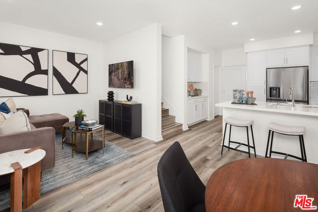 This is the final 3-bedroom + loft home available in the community, and it's an end unit that welcomes you with abundant natural light throughout. The flexible loft is the perfect spot for a home office, playroom, or lounge, adding valuable living space to the open and airy floor plan. Inside, the home features a pantry, a laundry closet, upgraded LVP flooring, and all appliances are included, giving you a complete move-in ready package. Smart home touches include a smart thermostat, and energy efficiency comes built in with solar panels, available for lease or purchase. A private 2-car garage provides parking and additional storage. Located near the community common area and guest parking, this home combines convenience and comfort in one of the most desirable spots within The Grove. Available now for immediate move in, this is your chance to make the final 3-bedroom + loft residence yours. Virtual tour and photos are of former model home and used for representational purposes only.