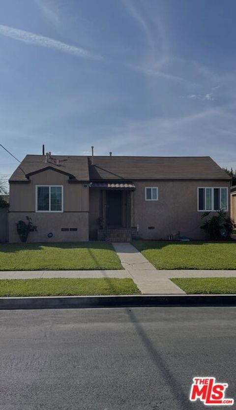 Photo of 11831 Orchard Avenue, Los Angeles, CA 90044 (MLS # 26660179)