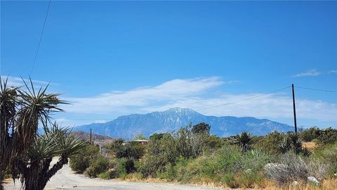 Photo of 9191 Rawson Rd, Morongo Valley, CA 92256 (MLS # JT26093409)