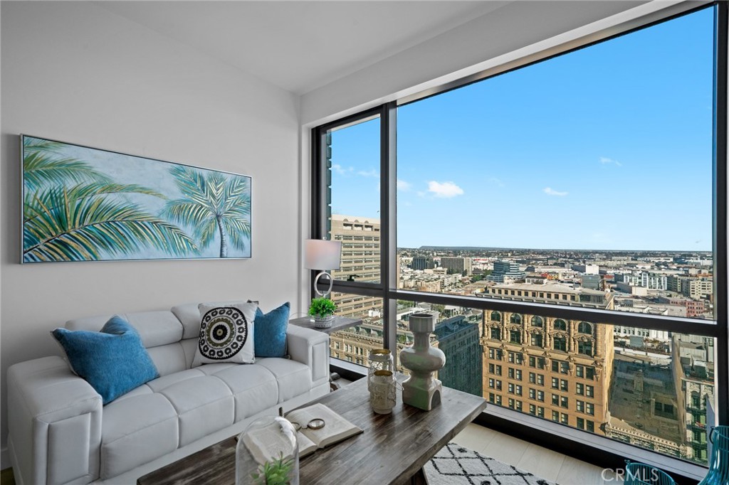 Welcome to this magnificent end unit located at the 21th floor of brand new PERLA luxury condo in the heart of DTLA. The PERLA building was designed to allow its residents enjoy life more easily. Located conveniently close to all the dinning, shopping and entertainment including the Grand Central Market and Disney Hall. Upon entering the lobby area, you and your guest will be greeted with 24 hour receptionist while your eyes explore the spacious waiting area with comfortable European style setting & furnishings. The amazing luxury amenities include rooftop terrace with 360 degree views, fitness center, private theater, private dining room, wine tasting room, entertainment room, outdoor BBQ, outdoor swimming pool, hot tub, Dog Park, pet spa, and outdoor BBQ areas. This unit features approx. 903 sqft of open living spaces with large living area overlooking the downtown skyline, large bedroom with walk-in closet, full bathroom, open kitchen & dining area with stone counter-top and brand new appliances. Motivated Seller!! Must come to appreciate!