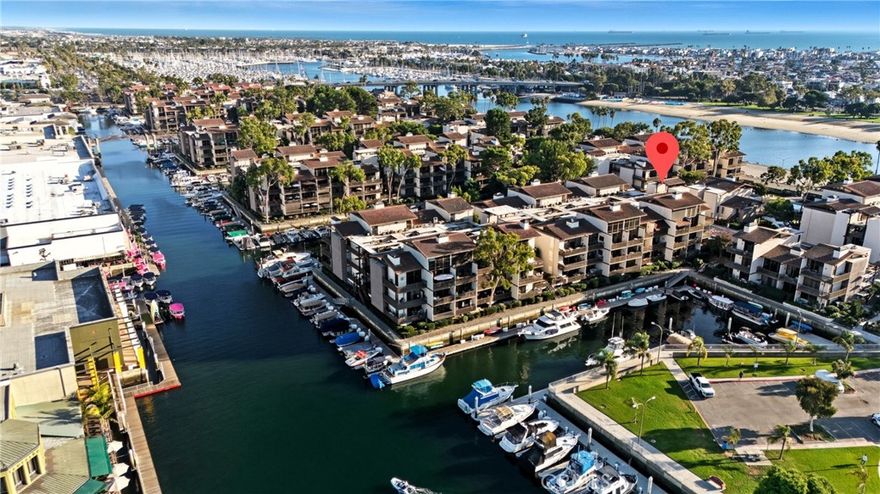 Welcome to 6209 Marina Pacifica Drive N, a beautifully renovated townhome-style condo in one of Long Beach’s most sought-after waterfront communities — known for its resort-style amenities, coastal charm, and setting on Alamitos Bay, home to the 2028 Olympic rowing events.



Blending modern sophistication with relaxed coastal comfort, this move-in-ready home captures the essence of Southern California living — stylish, effortless, and close to everything.



Spanning over 1,500 square feet, this two-bedroom plus den, three-bath layout offers generous open living spaces and two expansive wraparound balconies that extend your living area outdoors. Upstairs, the open-concept living and dining rooms flow seamlessly into a designer kitchen with custom cabinetry, quartz countertops, and high-end appliances — ideal for both entertaining and everyday living.



The lower level, with a separate private entrance, features a serene primary suite with balcony access and a spa-inspired bath. A flexible open den area offers the perfect space for a home office, gym, or creative studio, while a second en-suite bedroom ensures comfort for guests or extended family. Thoughtful upgrades throughout combine modern design with easy livability.



Set on 18 acres surrounded by scenic waterways, Marina Pacifica offers a resort-inspired lifestyle with six pools, six spas, three lagoons, a gym, clubhouse, and 24-hour guard-gated security. Residents enjoy direct marina access for kayaking, paddleboarding, and boating, plus a private pedestrian bridge to local favorites including Nigel’s, Ralphs, Club Studio, and the movie theater. Just outside the gates, you’ll find Gelson’s, and across the way, 2nd & PCH — home to A’s Restaurant, Whole Foods, Sephora, and more.



Perfectly positioned near Naples Island, Belmont Shore, and Seal Beach, this vibrant coastal community offers an unbeatable blend of location, lifestyle, and waterfront living.



Discover the best of Long Beach waterfront living at 6209 Marina Pacifica Drive N — where comfort, style, and coastal sophistication come together beautifully.