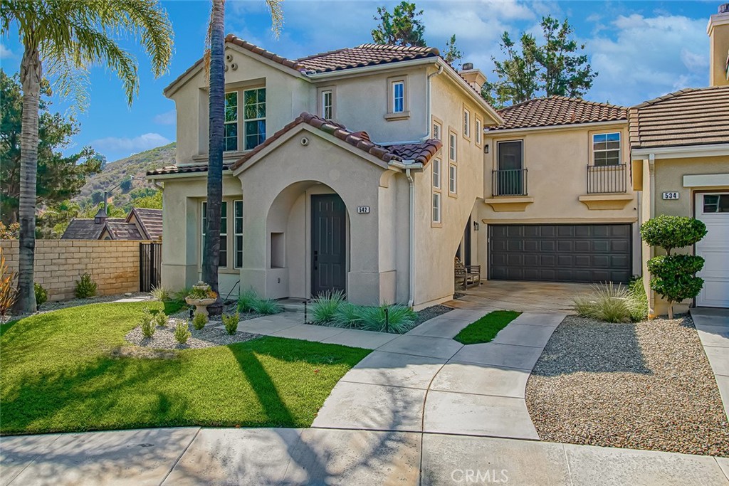 Exquisite Former Model Home in Guard-Gated Long Canyon at Wood Ranch. Welcome to luxury living in the exclusive Windmill neighborhood of Long Canyon, Simi Valley! This stunning former model home is ideally located at the end of a quiet cul-de-sac, offering breathtaking mountain views, exceptional curb appeal, and a long, private driveway. Step inside and be greeted by rich Country Breeze wide-plank flooring and designer black-and-white accents throughout—elegance and style in every detail. The beautifully updated kitchen is a chef’s dream, featuring Quartz countertops, stainless steel Frigidaire appliances, a subway tile backsplash, and a center island perfect for entertaining or casual dining. The family room is a showstopper with its dramatic black custom built-ins, shiplap siding, and a sleek stacked-stone fireplace—a space that effortlessly blends warmth and sophistication. A stylish powder room downstairs adds convenience for guests. You’ll find four bedrooms, including one currently used as a home office with custom built-ins and plantation shutters. The primary suite is a serene retreat, complete with a spa-inspired en-suite bathroom featuring dual sinks, a separate shower, an oval soaking tub, and a stunning backlit mirror. Step outside to your private backyard—perfect for entertaining or unwinding—with a hot tub and space to relax under the stars. Living in Long Canyon means enjoying resort-style amenities including four community pools and spas, a clubhouse, fitness center, and access to scenic Windmill Park and miles of beautiful hiking and biking trails. You’re also just minutes from the prestigious Wood Ranch Golf Club and the Ronald Reagan Presidential Library. This is more than a home—it’s a lifestyle. Don’t miss your chance to make this one-of-a-kind property yours!