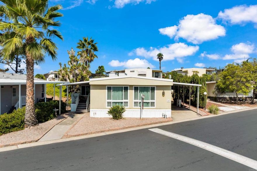 Located in the highly desirable Bayview Mobile Home Park Community is this Exquisitely maintained 2-bedroom, 2 full-sized bath mobile home on a generously sized lot,  with almost all newer dual pane windows, 2 wonderfully appointed living spaces, office area currently being used as as a bedroom, eat at bar area off the kitchen, separate dining room with built ins, glorious primary bedroom which includes an en suite bathroom, lovely jack and jill secondary bath, offset kitchen with gas stovetop, separate additional grill, beautiful outdoors sitting areas in 2 covered decks, parking for the unit under covered carport. Close to everything in San Diego area in about a 15 minute drive including schools, restaurants, shopping, hiking, biking, libraries. Must be park approved by management-space rent to next owner is $1250.00. Start your new life  here!