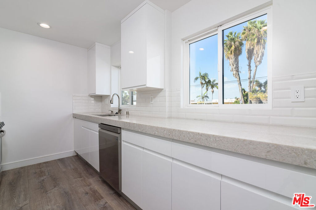 Fully remodeled 2 bedroom 1 bathroom apartment available, located 1.8 miles from Downtown Fullerton and 2.4 miles from Fullerton College. Property features brand new stainless steel LG appliances, air conditioning and heating throughout the entire apartment, and brand new vinyl flooring. The unit also features an exceptional fully tiled bathroom with both floor and wall tile, combined with a walk-in shower for a truly peaceful spa like experience. The spacious galley kitchen has designer Quartz countertops from Bedrosians, a gas LG range, dishwasher, refrigerator and freezer, and offers ample area for storage, cooking, and counter space. The unit has been meticulously remodeled, and no expense was spared to make sure that it is completely up to 2025 living standards. Fully remodeled epoxy floor spacious 2 car garage also available for an additional $400 per month.