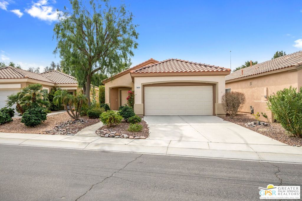 Bright and welcoming 2-bedroom, 2-bath home in Sun City Palm Desert, a premier 55+ community. Open, single-level floor plan with natural light throughout and spacious living and dining areas. Kitchen offers ample cabinetry and counter space, ready for your personal updates or modern touches. The primary suite features an en-suite bath and walk-in closet. Guest bedroom and bath provide comfort for visitors. Covered patio overlooks lush, landscaped surroundings perfect for morning coffee or evening sunsets.Enjoy resort-style living with access to three clubhouses, pools, fitness centers, restaurants, golf, tennis, pickleball, and walking trails all minutes from shopping, dining, and entertainment in the Coachella Valley.