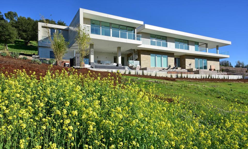 Signature modern architecture with panoramic views of Western and Stanford Hills. New turn key construction located in Los Altos Hills, 2 miles from downtown Los Altos and Stanford University. Voice-activated smart home designed by AltoVision Design Group using cutting-edge materials with attention to detail. Total development 9,000 SF, consisting of 6,430 SF of interior living space, 1,900 SF of covered patio and 680 SF 3 car garage with 6 bedrooms and 6.5 bathrooms plus outdoor shower, over 3 levels with elevator. Over 10,000 SF of Italian Porcelain tiles throughout with underfloor heating. Ultra-durable CFP panels and Spanish limestone facade, floor-to-ceiling multi-slide windows with Solex glass, makes this property minatance free and Eco friendly. With solar panels and dedicated Inverter for home batteries and car chargers. Tiled infinity pool and covered jacuzzi with vanishing edge and waterfall walls. Professionally landscaped grounds of 1.62 acres. Excellent Palo Alto schools.