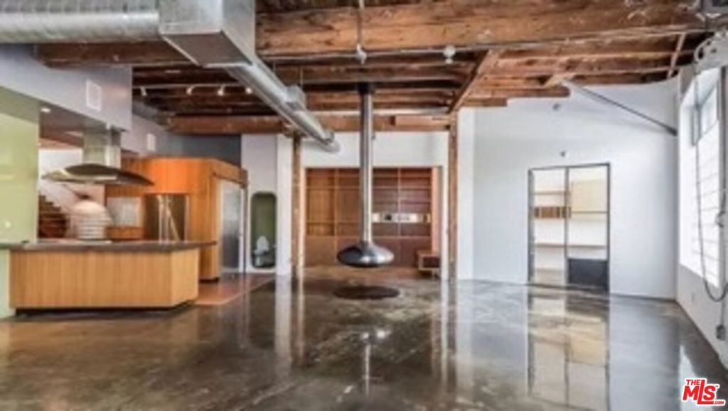 Welcome to 122 Mildred a sleek, 3,000 sq. ft. true live/work architectural masterpiece in the heart of Venice! Designed for work, play, and everything in between, this dynamic space blends style and functionality across three levels. The first floor encompasses 1,500 sq. ft. of versatile living with two enclosed offices, a cozy library nook, and an orb fireplace. The chef's kitchen with concrete countertops opens to a private garden with a fire pit, surf shower, and storage, plus a 4-vehicle carport for effortless parking. The second floor incorporates a master suite/executive office with a spa-like bath and expansive private deck your ultimate retreat. The third floor has A full-bath executive suite/bullpen that leads to a stunning mountain-view roof deck with artificial turf and a full outdoor kitchen, perfect for entertaining under the stars. Private entrance on Canal St. cul-de-sac offers exclusivity in a prime location.122 Mildred is where innovation meets luxury whether you're running a business, hosting, or just living large. Let's make it yours!