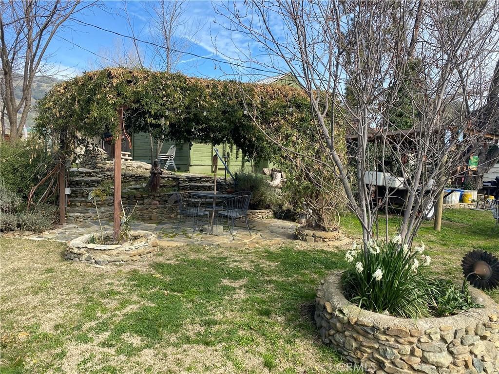 Formerly known as the Airport Bar & Grill, this unique property offers a combination of commercial and residential opportunities. Located in the historic area of Mariposa, California, this property features the former bar and grill, zoned for indoor and outdoor dining, and three residences. The property has great potential for rental income and a commercial restaurant or convenience store. The restaurant was a very popular social spot for locals and travelers. The three rental residences include a studio apartment, a one-bedroom apartment, and a one-bedroom home with a loft. Situated on Highway 49 it is a perfect stop for locals and travelers alike, and could be a great business, rental income property, and homesite. Spacious yards that are loaded with beautiful flowing landscape, arbor, a stage and green lawns. The perfect place for family gatherings and those summer parties.