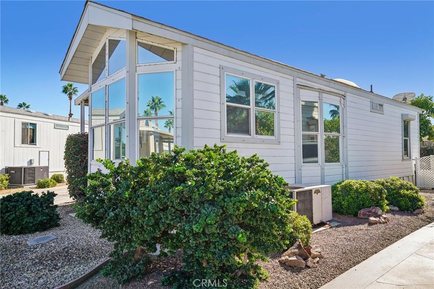 Your perfect entertainment spot.  This unit is on a large private lot with a block wall behind, but not on Avenue 49, so no road noise.  The deck is also huge.  Inside you'll find the majority of the coach was renovated.  The bathroom was updated, all the floors were replaced, new electrical & plumbing, and a new dream kitchen.  The cabinets are so convenient with soft close and pull out drawers for easy reach.  Yes, the countertop is quartz. Check out the coffee/breakfast bar.  Useful and stylish. This is a very desirable location in an equally desirable park. Tons of activities to get involved in.  There is pickleball, shuffleboard, water sports, card games, billiards room, quilting, concerts at the pool, guided tours to local and regional sites, competitive annual games and so much more.  Act now and winter in style.