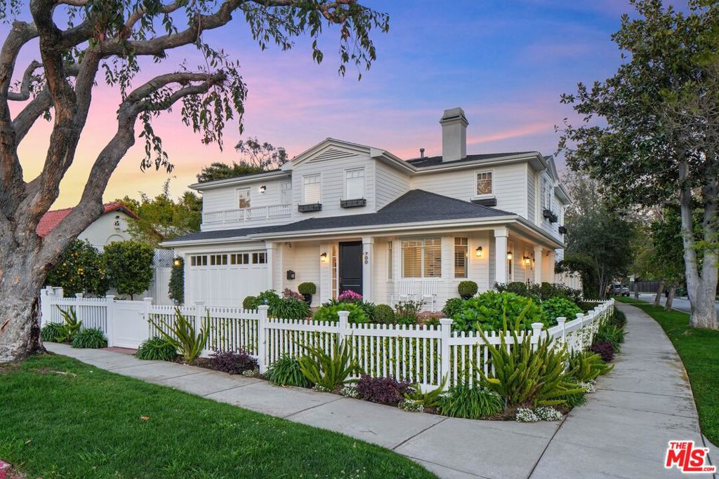 Introducing an exquisite New England Traditional nestled on a generous 7,565 square-foot corner lot within the esteemed El Medio Bluffs enclave of Pacific Palisades. This expansive 4,120 square-foot home features 5-bedrooms, 6-bathrooms, and impeccable details, from rich walnut floors to architectural moldings to smart home tech like surround sound and a whole-house Generac generator. At the heart of the home is the gourmet kitchen, a culinary haven equipped with top-tier appliances including a Wolf range, SubZero refrigerator, and U-Line wine fridge, along with dual sinks, a spacious walk-in pantry, and a breakfast nook with bench seating. Adjacent to the kitchen is a cozy family room with built-in cabinetry and access to a home office, ideal for casual gatherings or quiet work sessions. The main level further hosts formal dining and living rooms, a powder bath, and a bedroom suite. Upstairs, discover four additional bedroom suites and a convenient laundry room. Among these, the primary retreat boasts a cozy sitting room, a private balcony, ample closet space, and a luxe en suite bath with a separate steam shower and soaking tub. Enter the tranquil backyard through French doors, where a covered patio with a fireplace and built-in BBQ beckons for al fresco entertaining. Delight in leisurely days basking in the California sunshine by the Pebble Tec finished pool and spa, complete with a retractable cover and surrounded by lush landscaping including mature fruit trees like lemon, lime and tangerine. Parking is a breeze with an attached 2-car garage with an EV charger and direct entrance into the home, all secured behind an automatic driveway gate. Experience quintessential Westside living at its finest, with premier shopping, dining, and entertainment venues at Palisades Village, hiking/biking trails, and Will Rogers State Beach all within about a mile's reach.
