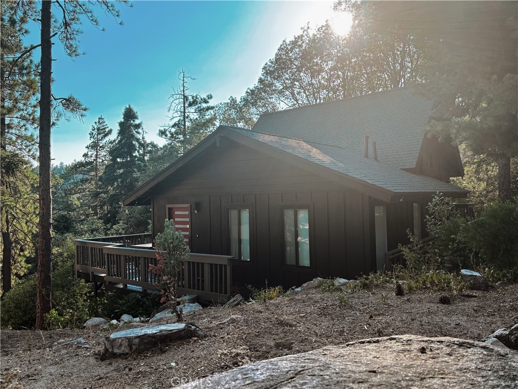 This fully remodeled modern mountain cabin is where style meets serenity. With coveted lake rights, you’ll have year-round access to the water—whether it’s Summer swims, Fall fishing, or Winter walks along the shore or on the slopes at nearby Snow Valley.
Inside, the open floor plan glows with light, while central AC keeps summer days crisp and a cozy fireplace warms snowy evenings. The entry level features a welcoming bedroom and bathroom—perfect for easy access after long lake days, just a few stairs up a sparkling kitchen and baths, all fully remodeled with polished finishes.
Every upgrade is ready for you—an impressive Generac generator with automatic transfer switch, quality fixtures throughout, and thoughtful details that make daily living effortless. Currently a successful short-term rental that comfortably sleeps six, this home can be delivered turnkey, so guests can start arriving the moment you get the keys.
With a wonderful neighborhood, forest views from every angle, and room to expand, it’s a place where both your income and your dreams can grow. Whether you’re here to paddle on the lake, sip coffee with the blue jays, or enjoy the satisfying hum of a well-run STR, this cabin wraps it all in one perfect, pine-scented package.