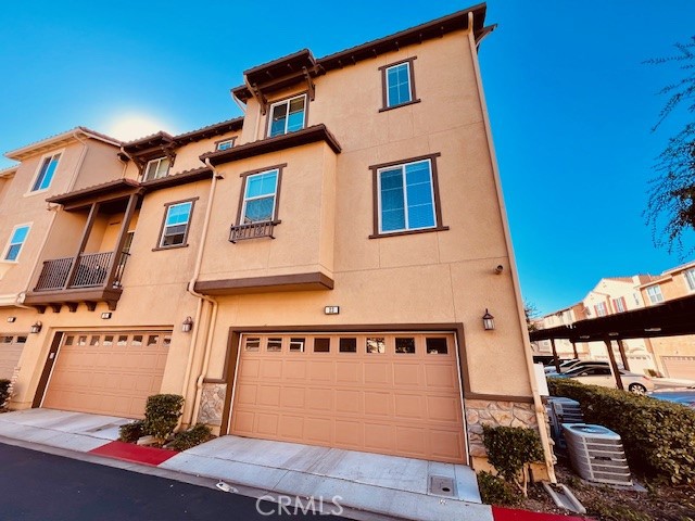 This exquisite and upgraded townhome, located in the newly developed community of The Ridge, is now available for lease! The pride of ownership is evident from the moment you step into this impeccably maintained residence. The warm and inviting living room boasts recessed lighting throughout, complementing the clean, neutral color scheme that enhances the naturally light and open floor plan. The transition to LED light bulbs throughout the home not only brightens the space but also contributes to energy efficiency, reducing the electricity bill. This beautiful home comprises three bedrooms, two and a half bathrooms, and an open kitchen adorned with granite countertops and stainless steel appliances. The main floor area features upgraded tile floors, while the upgraded carpet with plush padding adds a touch of luxury. The two-car garage, with direct access, offers ample storage and boasts epoxy flooring. The property includes convenient amenities such as an inside washer and dryer, along with a refrigerator—all of which are included with the lease. The community itself provides a tot lot, community pool, fireplace, and BBQ area, ensuring a well-rounded living experience. With its proximity to Target and other shops, as well as easy access to major freeways, this home is a must-see for those seeking a blend of comfort and convenience.