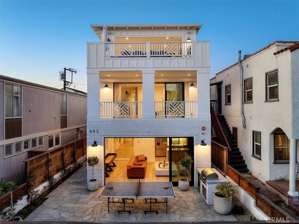 In one of the Sand sections best family neighborhoods, (the cul de sac streets of North Manhattan) 441 34th Street stands out as a beacon for the seamless fusion of function and sophisticated design. Highly customized, both during and after construction (2021), this 4-bedroom plus bonus room/office/gym, 6 bathroom 3,599s.f. coastal modern provides an exceptional family home on one of the Sand Sections most neighborly streets.
Experience coastal luxury at its finest in this newly constructed custom sand section ocean view home that has been meticulously and thoughtfully enhanced with state-of-the-art upgrades including Lutron Palladiom motorized roller shades, Control 4 operated lighting, sound and video system, toto automated bidet toilets, Ingo Maurer light fixtures, a custom outdoor shower. T
A short walk to the Strand, north town and award-winning Grandview Elementary School, this home delivers the beach lifestyle with a great walkable rating to shops, restaurants, school, beach and parks.
It starts on the top floor with the open floorplan featuring an exquisitely appointed chefs kitchen, charming family room nook, open dining area …expansive living area and a large covered and uncovered deck which embraces everything wonderful about our 72’ and perfect climate. The builder measured this home at 3,858 SF (builder measurements inclusive of heated and covered 3rd floor), and that doesn’t include a massive outdoor patio on the ground floor… generous water sports equipment side patio, complete with custom shower. Both the 1st Floor and 3rd floor include outdoor built-in kitchens on both outdoor entertaining areas as well as a 1st floor kitchenette fully equipped with a full-size refrigerator / freezer, dish-washer and sink. The master suite with its covered indoor/outdoor retreat patio, custom automated drapery, stone-clad fireplace, and spa-like master bath awaits. The owner has left no stone unturned, recently finishing the garage with epoxy flooring, fully enclosed cabinetry and custom shelving. This is an UNFURNISHED rental
