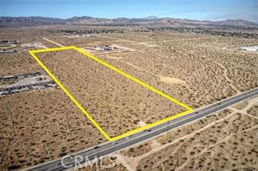 Prime commercial/industrial lot with Highway 62 frontage, 1/4 mile east of the main commercial center of Yucca Valley (Home Depot, Walmart, Petco, etc.). 38 acre zoned General Commercial & Industrial. Hwy 62 Frontage half is zoned General Commercial and the rear half of parcel is zoned Industrial. Property has many possibilities, including shopping center or mixed use. Industrial half of parcel can possibly be split off and sold separately at a later date to capitalize commercial frontage (buyer to check. Seller nor broker guarantee). Property to be auctioned October 8. Call for details.